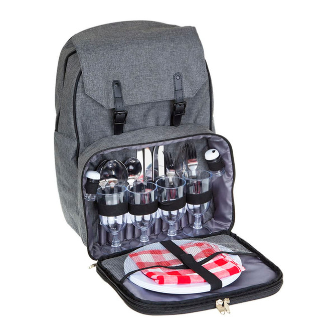 A grey backpack opened to reveal glassware, cutlery, plates, and a gingham cloth inside. It features a logo.