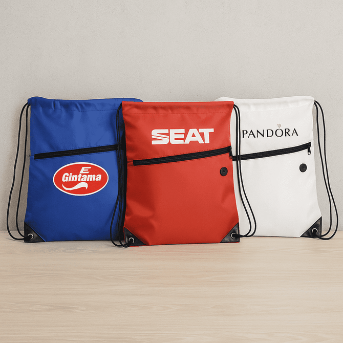 Three drawstring bags in blue, red, and white, each with a distinct logo and a front zip pocket.