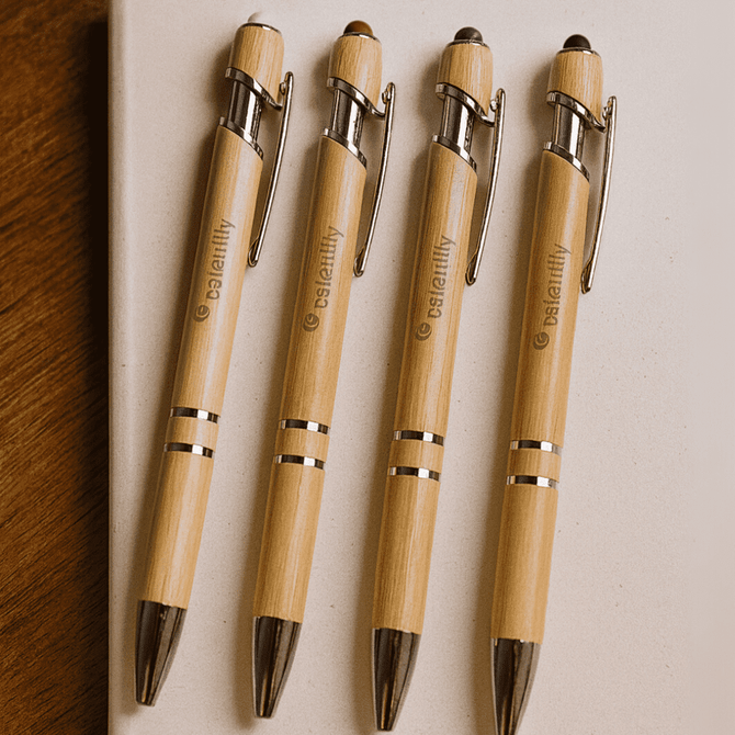 Four bamboo stylus pens with silver accents arranged on a light surface, each featuring a branding logo.