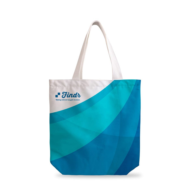 A velvet tote bag featuring a full-colour design in shades of blue with a logo. It has white handles.