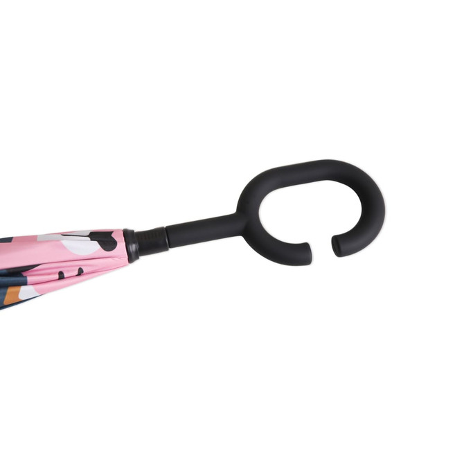 A children's reversible folding umbrella with a pink, patterned canopy and a black hook handle.