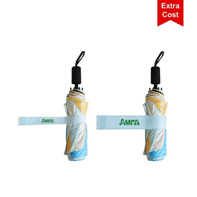 A compact, folded umbrella featuring a blue, yellow, and white design, secured with a fabric strap and a logo.