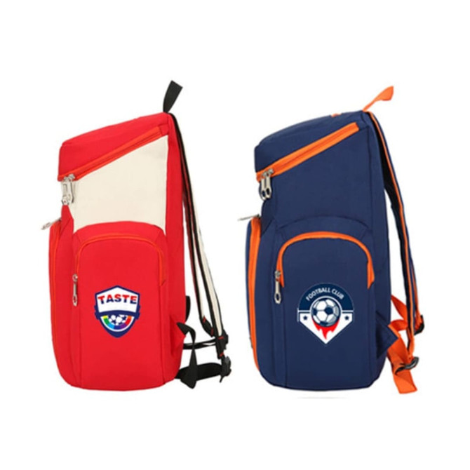A red and navy blue basketball backpack with orange accents and a logo on each side.