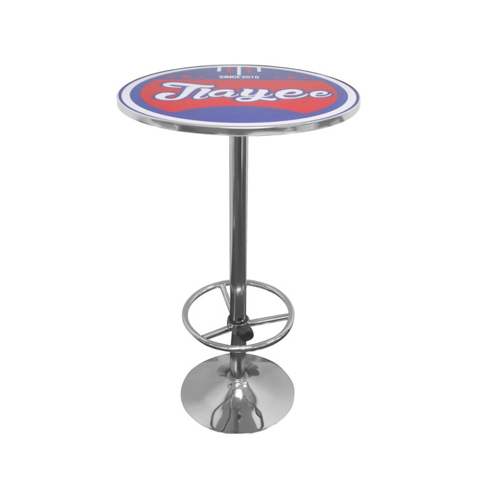 A round blue and red bar table with a chrome base and circular footrest, featuring a logo on the top.