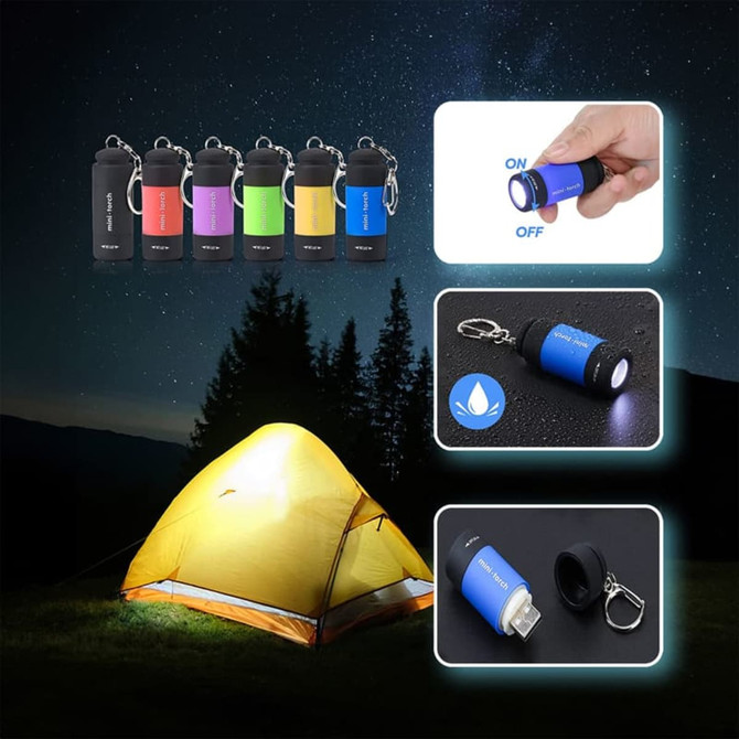 A set of colourful rechargeable LED torches with keychain attachments, displayed against a night landscape with a tent.
