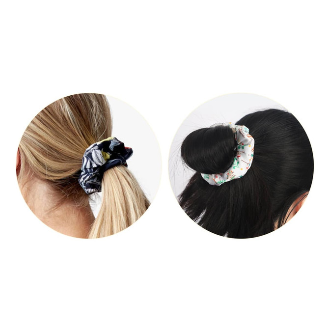 Two hair scrunchies in different styles: one patterned in black and the other in white with floral designs.