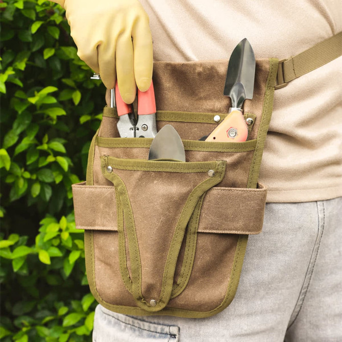A garden tool waist pouch in brown with green accents, featuring multiple pockets for tools.