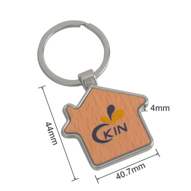 A wooden keyring shaped like a house with a silver keyring attachment and a logo on the front.