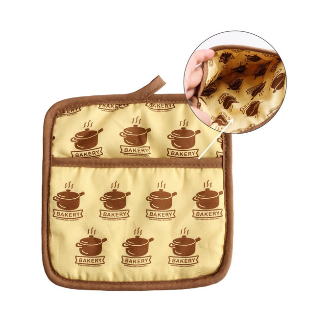 A large quilted pot holder in yellow with brown bakery-themed print and a brown trim, featuring a patterned interior.