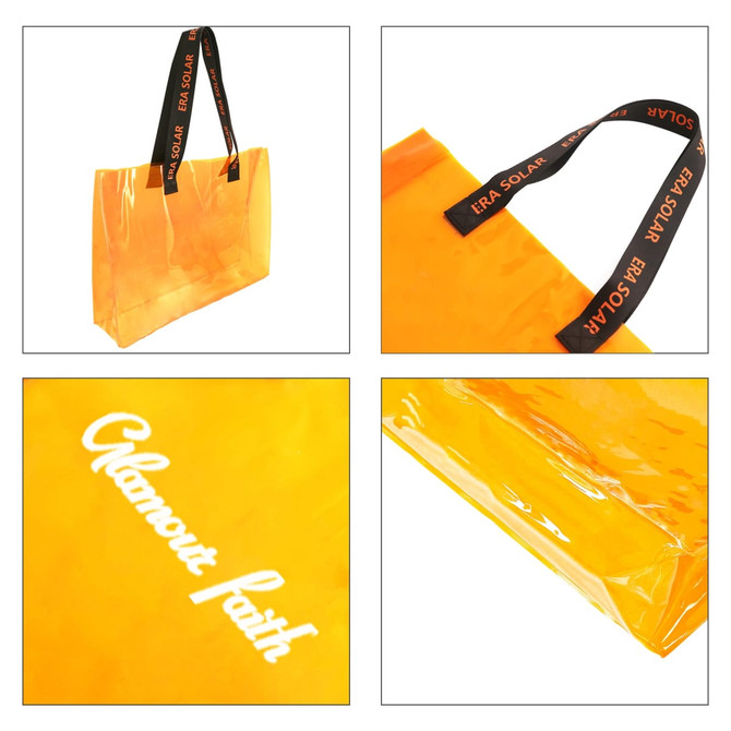A clear tote bag in bright orange with black handles featuring a logo. The bag has a glossy finish.