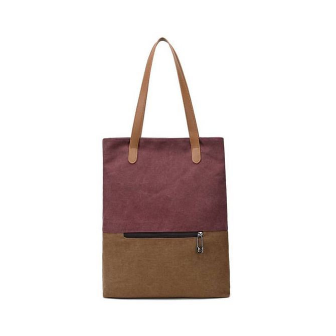A convertible canvas backpack and tote bag in maroon and brown, featuring two long straps and a zippered pocket.