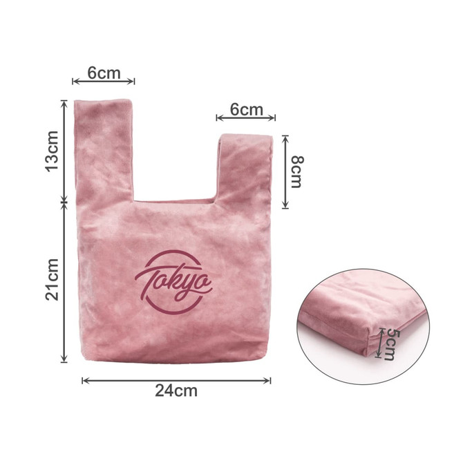A pink velvet knot wrist bag with a logo, featuring a rectangular body and dual handles. Dimensions included.