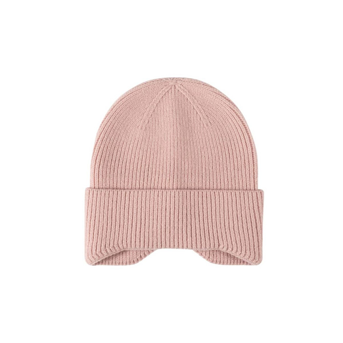 A pink earflap beanie with ribbed texture and a folded cuff. It features a logo on the side.