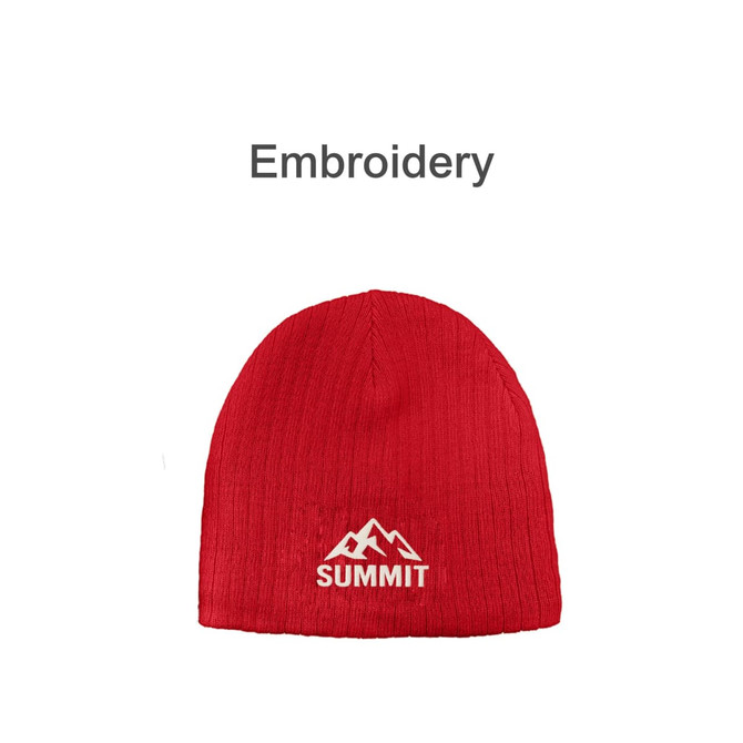 A red cable knit beanie featuring an embroidered mountain logo.