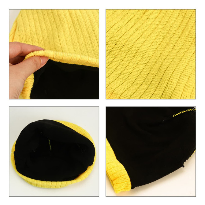 A yellow cable knit beanie featuring a textured ribbed design and a black interior with visible stitching.