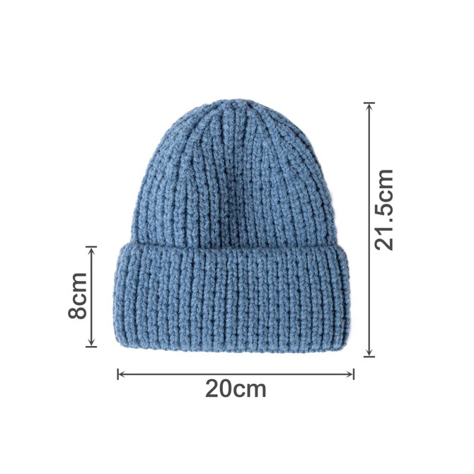 A twisted cable cuffed beanie in a soft blue shade, featuring a ribbed texture and measurements stated.