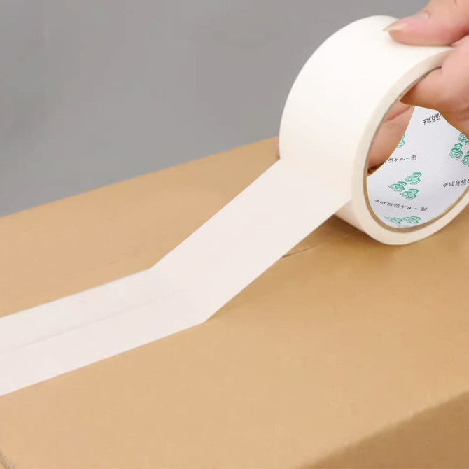 A roll of white BOPP packaging tape is being applied to a cardboard box. The tape has a logo on the backing.