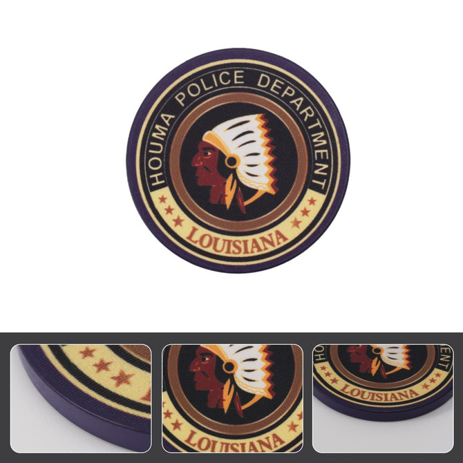 A round poker chip in purple, featuring an emblem with a profile of a Native American and a police department logo.