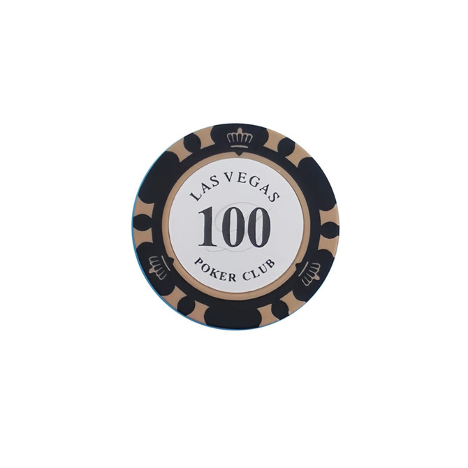 A round poker chip featuring black and gold design elements with a central white circle and a logo.