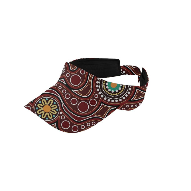 A full sublimation visor featuring a vibrant pattern with reds, greens, and yellows. It has an adjustable strap and logo.