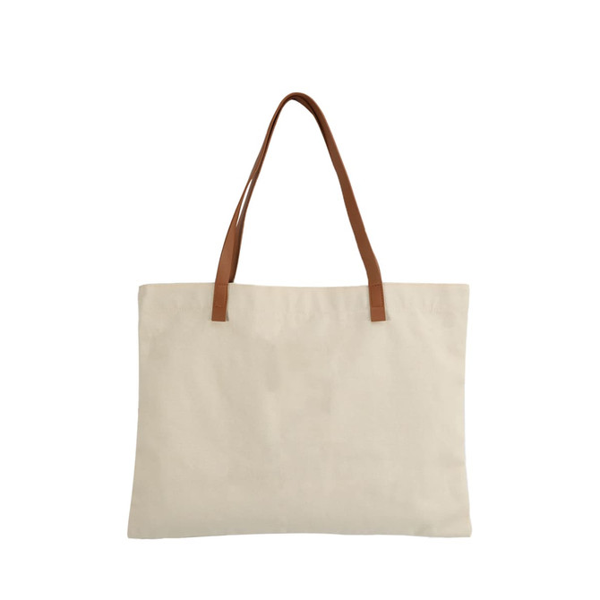 A canvas bag in beige with brown leather straps, featuring a plain design and a logo on the side.
