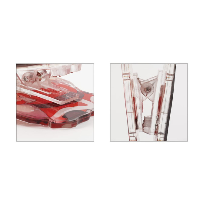 Acrylic magnetic clip in clear and red colours, featuring a logo on its side. Close-up view of the clip mechanism.