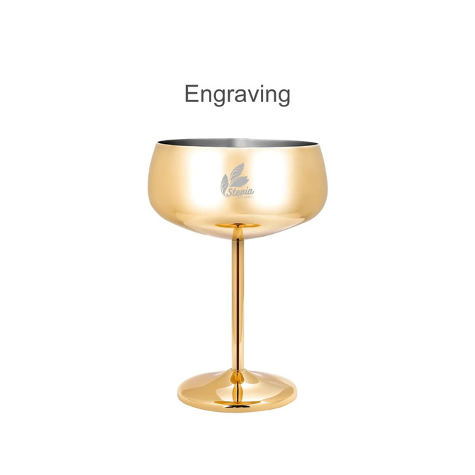 A stainless steel cocktail coupe in a shiny gold finish, featuring a logo on the side.