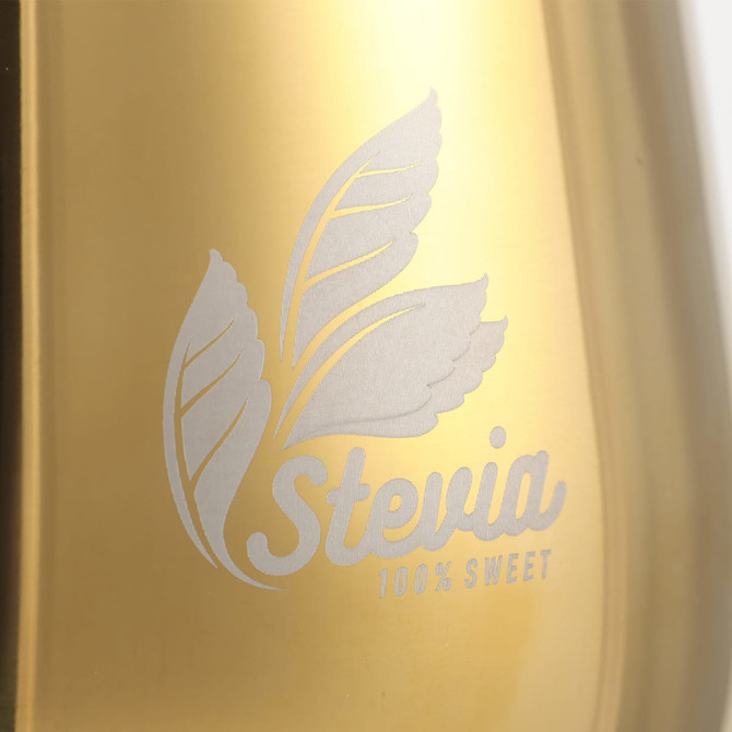 A stainless steel wine goblet in gold, featuring a simple logo design with leaves.