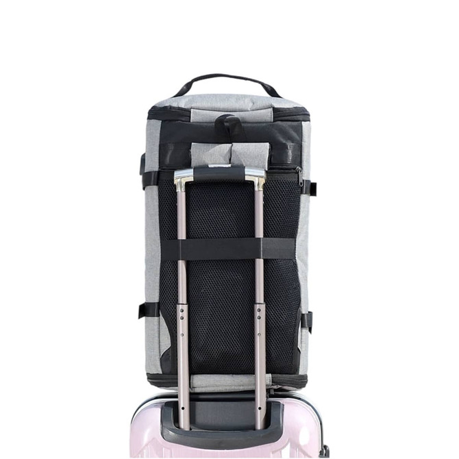 A grey convertible bucket backpack duffel bag with a black mesh pocket and retractable handles, attached to a suitcase.
