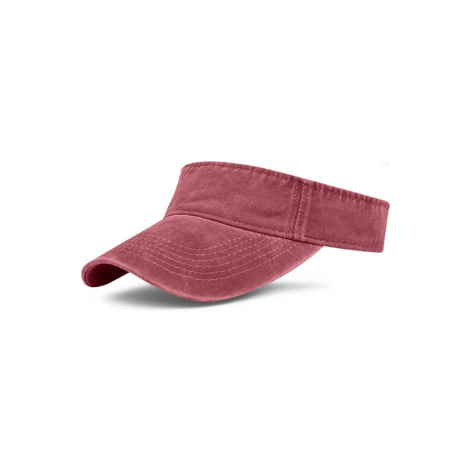 A washed sun visor in a muted rose colour with a wide brim and soft fabric. It features a logo on the band.