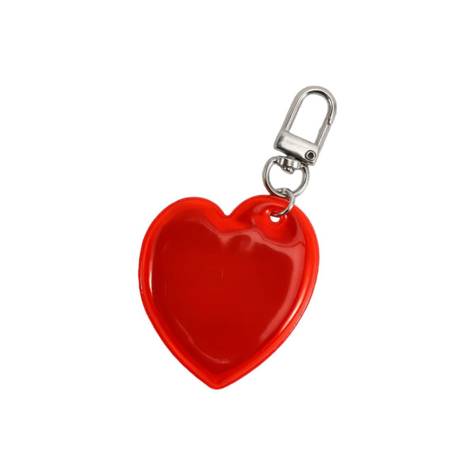 A red heart-shaped keychain with a silver clip attached. The keychain has a glossy finish and includes a logo.