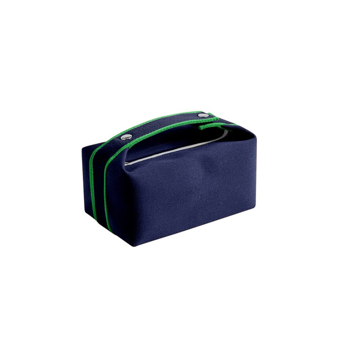 A navy blue portable canvas cosmetic bag with green accents and a handle, featuring a zippered opening.