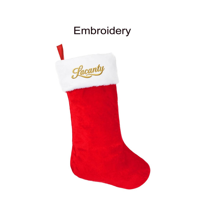 A red Christmas stocking with a white fur cuff and gold embroidery. It features a logo on the cuff.