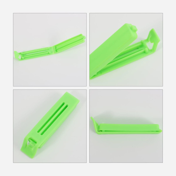 A green plastic clip for sealing small food bags, designed with an open and closed position for easy usage.