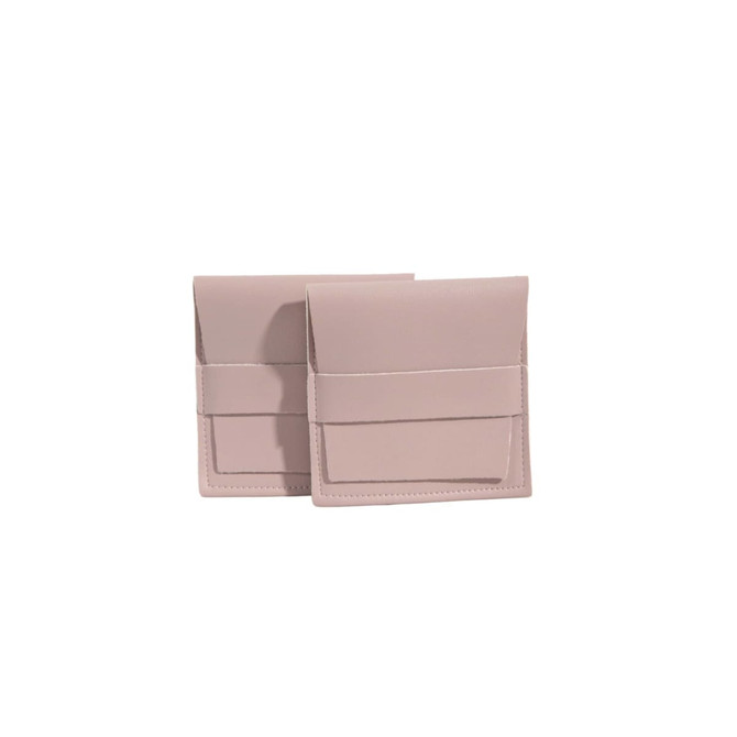 Two pale pink PU leather flip jewelry pouches with a simple design and a front pocket.