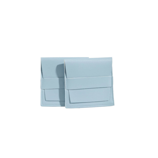 A light blue PU leather flip jewelry pouch, featuring a fold-over design and a front pocket. Two pouches are displayed.