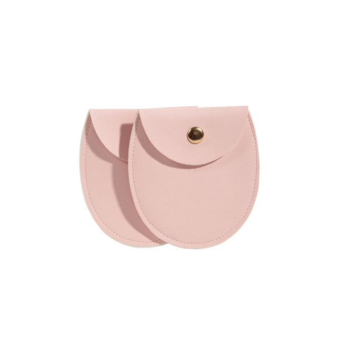 A pink oval PU leather jewelry pouch with a snap closure, featuring a smooth texture and a simple design.