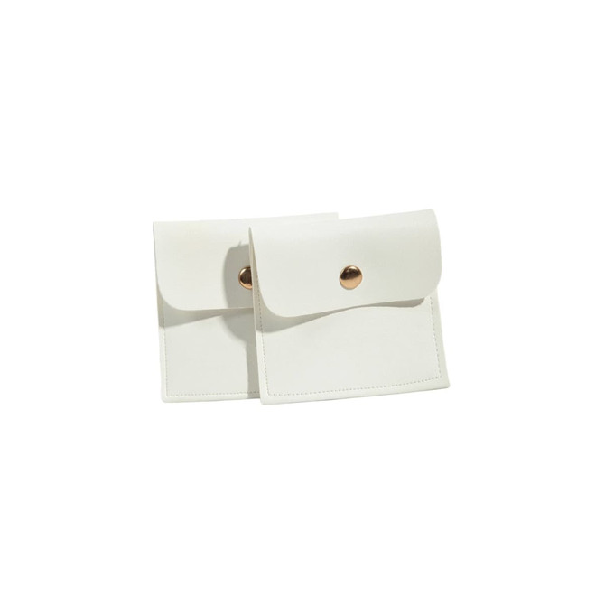 A set of two white PU leather jewelry pouches featuring a snap button closure and a sleek design.