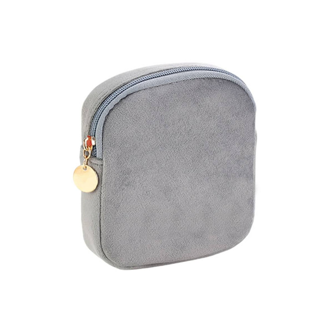 A square, light grey mini makeup bag with a zip closure and a decorative charm. Designer logo visible.