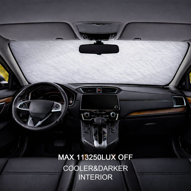 An aluminum snow cover inside a car, featuring a light silver colour, with dark leather seats and dashboard.