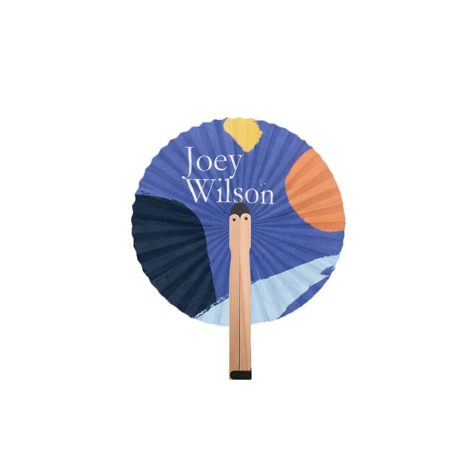 A round wooden paper fan featuring a vibrant blue and orange design, with a wooden handle and a logo.