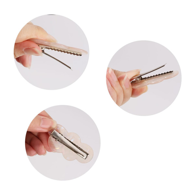 A cloud iridescent alligator hair clip in various angles, showcasing its shape and metal clasp.