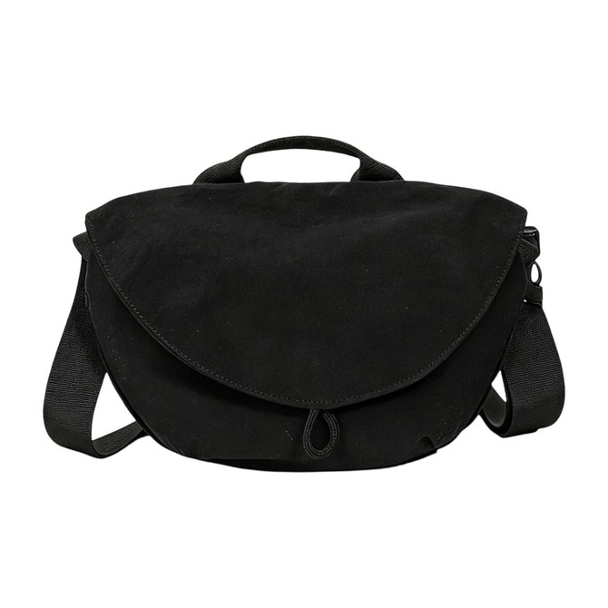 A casual black crossbody bag with a flap closure and adjustable strap, featuring a handle on top.