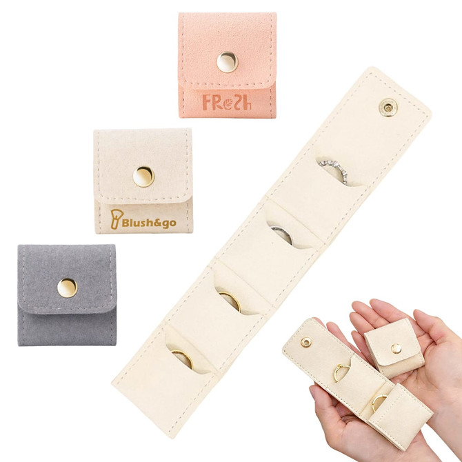 Mini synthetic leather jewellery bag available in pink, beige, and grey, featuring multiple compartments and a secure snap closure.