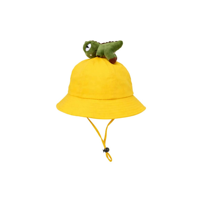 A yellow bucket hat featuring a plush dinosaur perched on top, complete with an adjustable chin strap.
