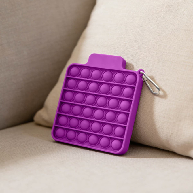 A purple silicone pop bubble board with a clasp, featuring multiple raised bubbles for pressing.