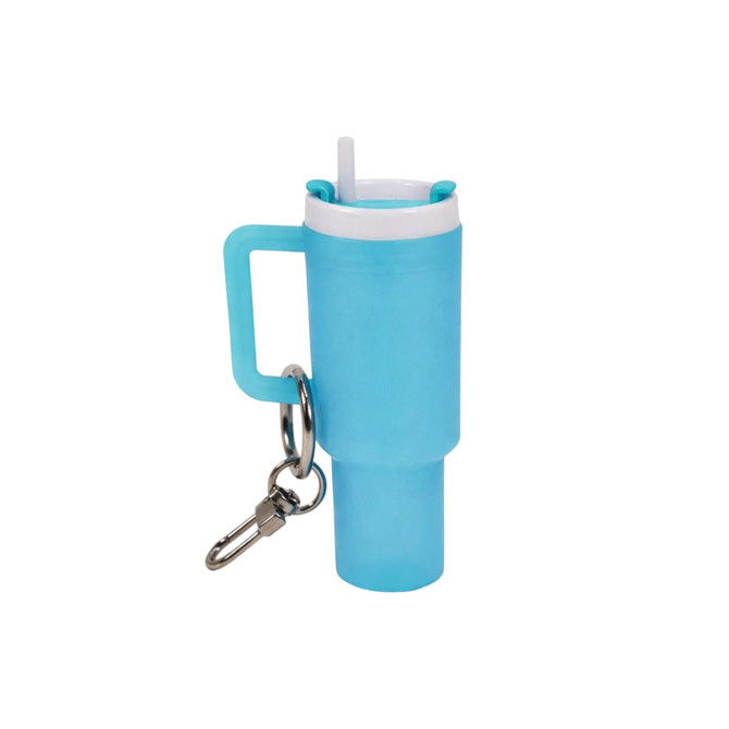 A glow-in-the-dark mini tumbler keyring in light blue, featuring a straw and a metal keyring attachment.