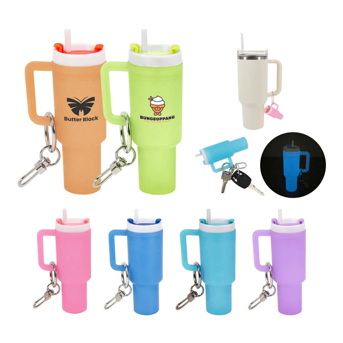 A mini tumbler keyring in various colours, featuring a straw, handle, and a logo, with a glow-in-the-dark option.