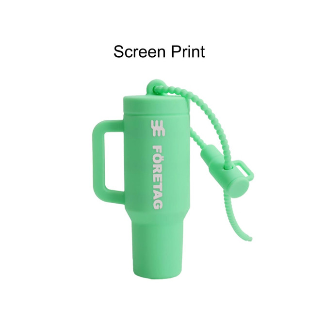 A mint green lip balm holder keychain featuring a loop for attachment and a secure cap. It includes a logo.