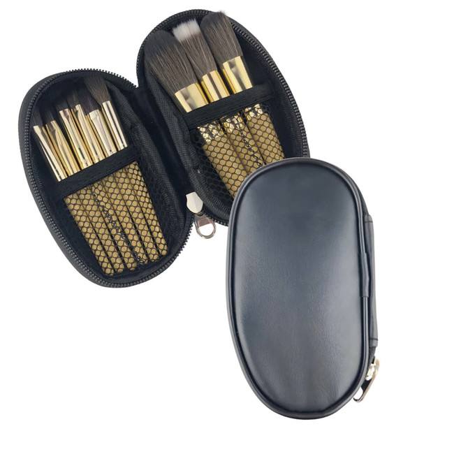 A black case opening to reveal nine brushes with golden handles and mesh pockets. The case has a zip closure.